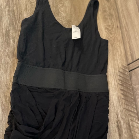 Black form fitting ruffled bottom styled dress - Picture 2 of 4